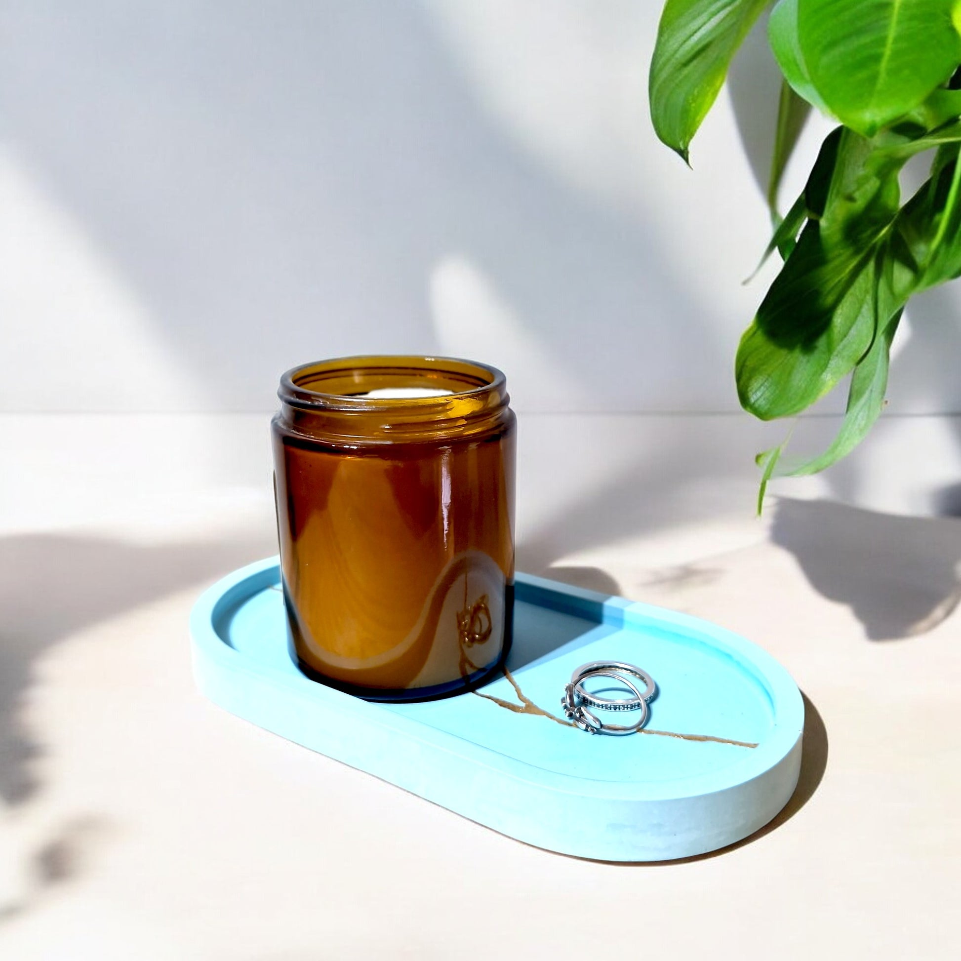 a handcrafted turquoise color tray with a candle on it - eco resin workshop melbourne