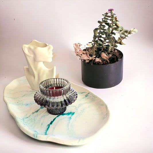 a decorative tray with a decorative accents in it
